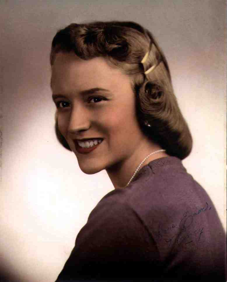 This is my Mother's senior picture. typical 50's style clothing and hair cut